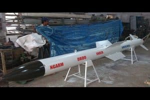 Black and white colored NGARM missile displayed on a stand